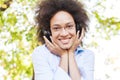 Beautiful Happy Afro American Young Woman Listening Music In Nature Royalty Free Stock Photo