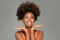 Beautiful happy afro woman smiling to the camera