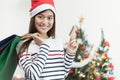 Beautiful happy asian girl with credit card in her hand,Christmas shopping concept Royalty Free Stock Photo