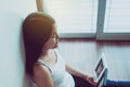 Beautiful happy asian woman looking photo album at home,Memory time photos,Happy and smiling Royalty Free Stock Photo