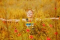 Beautiful happy blond woman enjoying the life. Freedom, nature, summer holiday and field of wheat concept Royalty Free Stock Photo