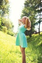 Beautiful happy blonde woman in dress at sunny spring Royalty Free Stock Photo