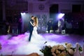 Beautiful and happy bride and groom dancing first dance at wedding. Royalty Free Stock Photo