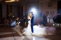 Beautiful and happy bride and groom dancing first dance at wedding. Royalty Free Stock Photo