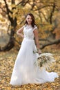 beautiful happy bride holding wedding autumn bouquet Royalty Free Stock Photo