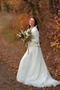 beautiful happy bride holding wedding autumn bouquet Royalty Free Stock Photo