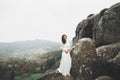 Beautiful happy bride outdoors in a forest with rocks. Wedding perfect day Royalty Free Stock Photo