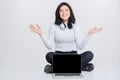 Beautiful happy brunette girl sitting with blank laptop Royalty Free Stock Photo