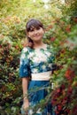 Beautiful happy brunette woman in the park on a warm summer day Royalty Free Stock Photo