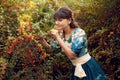 Beautiful happy brunette woman in the park on a warm summer day Royalty Free Stock Photo