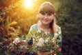 Beautiful happy brunette woman in the park on a warm summer day Royalty Free Stock Photo