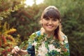 Beautiful happy brunette woman in the park on a warm summer day Royalty Free Stock Photo