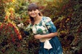 Beautiful happy brunette woman in the park on a warm summer day Royalty Free Stock Photo