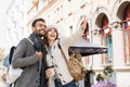Beautiful happy couple autumn portrait. Young joyful smiling woman and man in a city in winter.  Love, travel, tourism, students c Royalty Free Stock Photo
