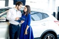 Beautiful happy couple standing near their new car Royalty Free Stock Photo