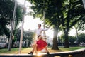 Beautiful happy couple in love embracing and dancing in evening sunlight in sunny street. stylish hipster groom and blonde bride Royalty Free Stock Photo