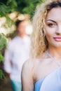 Beautiful happy couple in love posing, woman portrait in sunlight in city street. stylish hipster groom and blonde bride