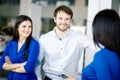 Beautiful happy couple standing near their new car Royalty Free Stock Photo