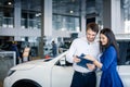 Beautiful happy couple standing near their new car Royalty Free Stock Photo