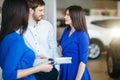 Beautiful happy couple standing near their new car Royalty Free Stock Photo