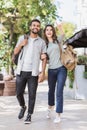 Beautiful happy couple summer portrait. Young joyful smiling woman and man in a city. Love, travel, tourism, students concept Royalty Free Stock Photo