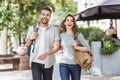 Beautiful happy couple summer portrait. Young joyful smiling woman and man in a city. Love, travel, tourism, students concept