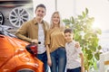 Beautiful happy family get keys by their new car Royalty Free Stock Photo