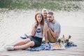 Beautiful happy family having picnic near lake Royalty Free Stock Photo