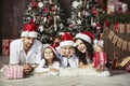 Beautiful happy family mother, father, son, and daughter to celebrate Christmas and new year together at home Royalty Free Stock Photo