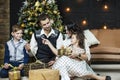 Beautiful happy family mother, father, son, and daughter to celebrate Christmas and new year together at home Royalty Free Stock Photo