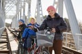 Beautiful happy family in the spring on a bike ride