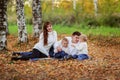 Beautiful happy family in sweaters with his two sons in the fore