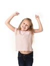 Beautiful and happy female child gesturing excited and smiling cheerful rising arms isolated on white