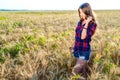 Beautiful happy girl in field, sunny afternoon, shorts shirt. concept of enjoying nature. Rest on the air. Walking Royalty Free Stock Photo