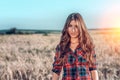 Beautiful happy girl in the field, sunny afternoon, shorts shirt. The concept of enjoying nature. Rest on the air Royalty Free Stock Photo