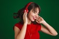 Beautiful happy girl listening music with headphones and dancing Royalty Free Stock Photo