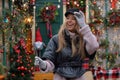 Beautiful happy girl model holding sparkler on the background of the Christmas house.Holiday concept Royalty Free Stock Photo