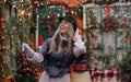 Beautiful happy girl model holding sparkler on the background of the Christmas house.Holiday concept Royalty Free Stock Photo