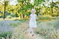 beautiful happy girl running in meadow. Beautiful warm summer evening. Little child in lavender field. Freedom, childhood, Royalty Free Stock Photo