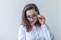 Beautiful happy girl smiling. Beauty simple portrait young smiling brunette woman in eyeglasses isolated on white background. Royalty Free Stock Photo