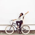 Beautiful happy girl on a vintage bicycle