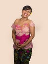 Beautiful and happy Indonesian Balinese woman in traditional religious ceremony dress smiling cheerful isolated on studio