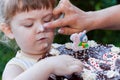 Beautiful happy little girl biting birthday cake Royalty Free Stock Photo