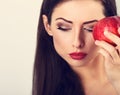 Beautiful happy makeup woman with red lipstick holding tast