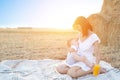 Beautiful happy mother breastfeeding her baby boy outdoor. Royalty Free Stock Photo