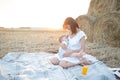 Beautiful happy mother breastfeeding her baby boy outdoor. Royalty Free Stock Photo