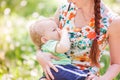 Beautiful happy mother breastfeeding outdoor Royalty Free Stock Photo