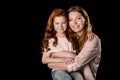 Beautiful happy mother and daughter hugging and smiling at camera Royalty Free Stock Photo