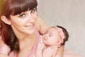 beautiful happy mother holding with love her little cute sleeping baby girl Royalty Free Stock Photo