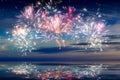 Beautiful happy new year fireworks in the sky with reflections on water Royalty Free Stock Photo